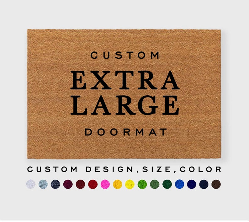 May include: A brown coir doormat with the text "CUSTOM EXTRA LARGE DOORMAT" in black lettering. The doormat is customizable with different designs, sizes, and colors. A color palette of 12 colors is shown below the doormat.
