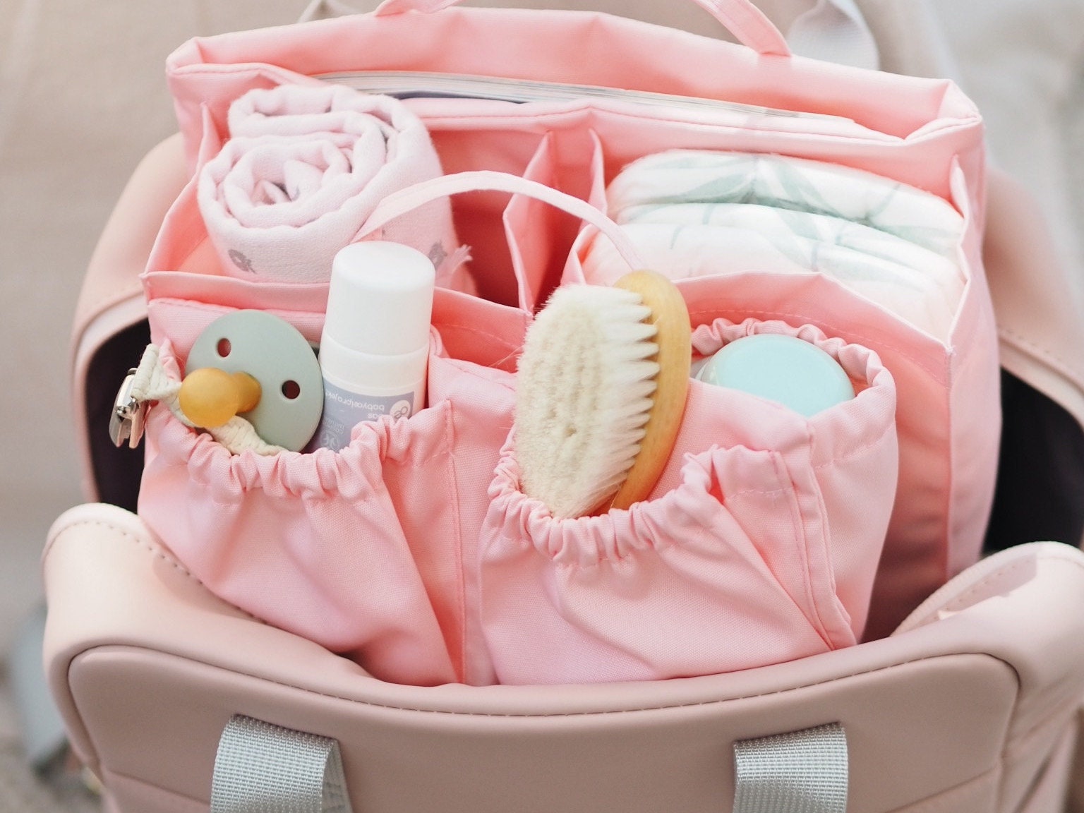 pink backpack changing bag