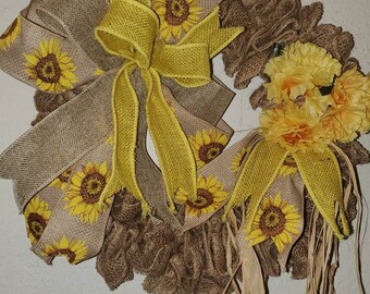 Sunshine Burlap Wreath with sunflower ribbon and yellow carnations