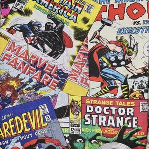 May include: A fabric print featuring a collage of vintage Marvel comic book covers including Captain America, Iron Man, Thor, Daredevil, and Doctor Strange. The colorful graphic design displays various superhero illustrations and bold comic book titles.