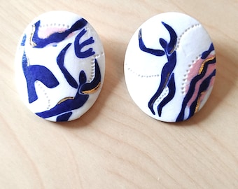 Unique earrings made of paper porcelain.