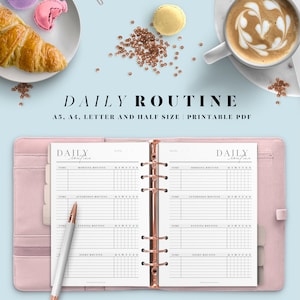 May include: A pink and white daily routine planner with a rose gold binder. The planner has sections for morning, afternoon, evening, and night routines. The text "DAILY routine" is printed on the cover.
