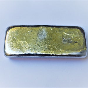 May include: A silver-colored metal bar with a textured surface.