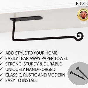 Pode incluir: Porta-toalha de papel de metal preto com um design de rolo. O suporte &eacute; montado em uma prateleira e inclui parafusos para instala&ccedil;&atilde;o.  "ADD STYLE TO YOUR HOME"  "EASILY TEAR AWAY PAPER TOWEL"  "STRONG, STURDY & DURABLE"  "UNIQUELY HAND-FORGED"  "CLASSIC, RUSTIC AND MODERN"  "EASY TO INSTALL"