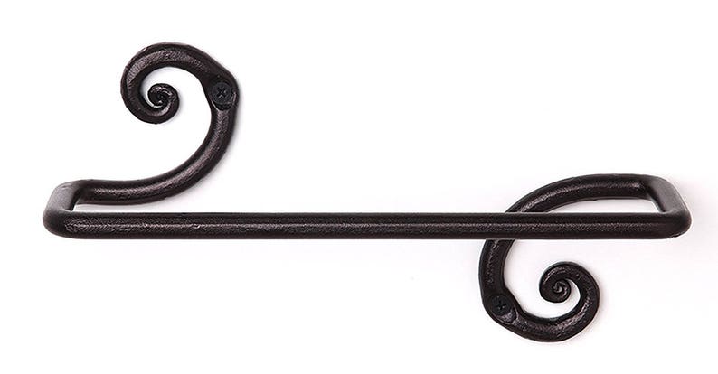 May include: Black wrought iron towel rack with two decorative scroll ends.
