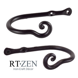 May include: A pair of black metal curtain tiebacks with a decorative swirl design. The tiebacks are designed to hold curtains in place.