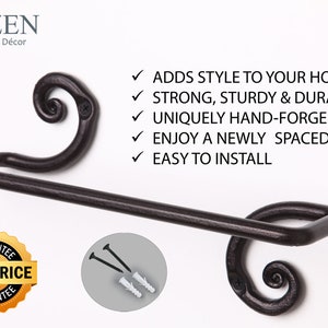 May include: Black wrought iron towel bar with decorative scroll ends. The bar is mounted on a white wall. The text "RT-ZEN Iron-Craft D&eacute;cor" is at the top of the image. The text "ADDS STYLE TO YOUR HOME STRONG, STURDY & DURABLE UNIQUELY HAND-FORGED ENJOY A NEWLY SPACED HOME EASY TO INSTALL" is on the right side of the image. A gold circle with the text "GUARANTEE BEST PRICE GUARANTEE" is in the lower left corner of the image. A close-up of the mounting hardware is in the lower right corner of the image.