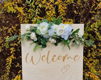 White and green wedding flowers, flower swag for wedding, wedding swag, flowers over welcome sign, floral arrangement for wedding mirror