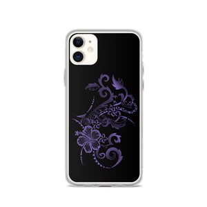 May include: A clear phone case with a black background featuring a purple floral design. The design includes hibiscus flowers and swirling patterns. The phone case is designed for an iPhone.