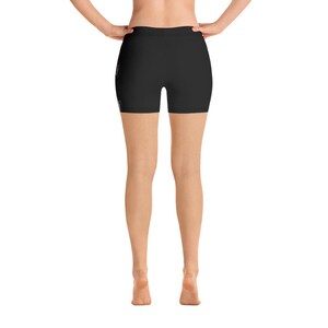 May include: Black athletic shorts with a high waist and a fitted silhouette.