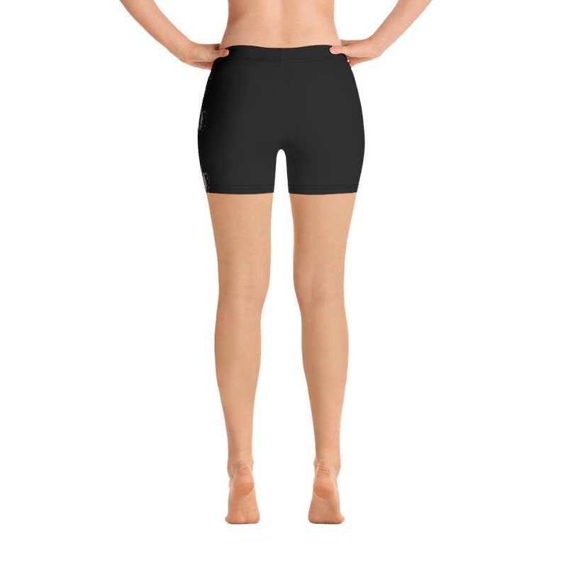 May include: Black athletic shorts with a high waist and a fitted silhouette.