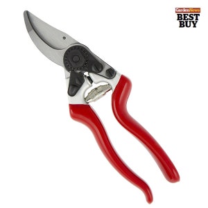 May include: Pruning shears with red handles, silver blades and a black adjustment knob.