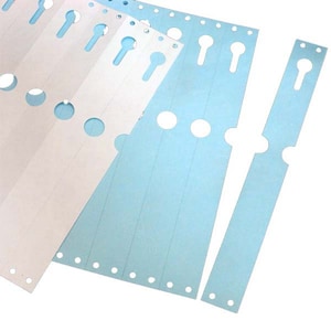 May include: A sheet of white plant labels with blue plant labels on top. The labels have holes for writing and a slot for attaching to a plant.