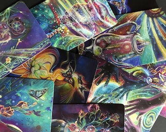 May include: A set of colorful cards with intricate designs featuring butterflies, flowers, and swirling patterns. The cards have a mystical and ethereal feel, with a focus on nature and spirituality.
