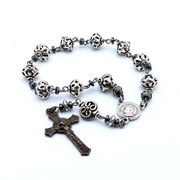 Saint John Paul II single decade pocket rosary beads with silver lattice beads and black Saint Benedict crucifix.