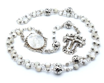 Our Lady of Grace Mother of pearl and stainless steel rosary beads with filigree Our Father beads and crucifix.