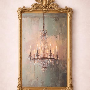 May include: A rectangular gold-framed mirror with ornate detailing. The mirror reflects a painting of a crystal chandelier with lit candles. The background of the painting has muted tones of green, beige, and pink.