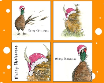 May include: A set of four Christmas cards featuring illustrations of a pheasant and a Highland cow wearing Santa hats. The cards are white with a black border and the text "Merry Christmas" printed on each card.