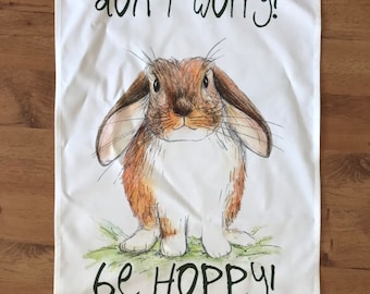 Don’t Worry Be HOPPY illustrated TEA TOWEL 100% cotton with hanging loop- Catherine Redgate bunny rabbit bun cute fluffy positive happy home