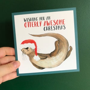 OTTERLY AWESOME CHRISTMAS illustrated Card blank inside- by Catherine Redgate humour fun whimsical quirky cute xmas funny otter otters pun
