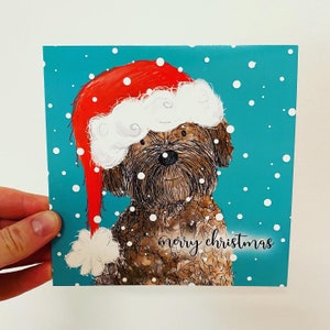 Joyeux Noël COCKAPOO carte vierge Catherine Redgate amusant lunatique original Noël festif chiens chiot mignon animal cartes bonnet de Noel neige hiver