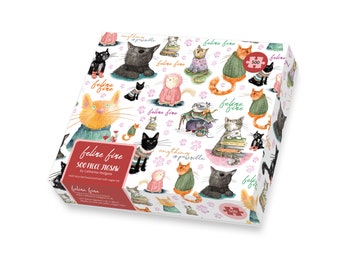 May include: A 500 piece jigsaw puzzle featuring a white background with a repeating pattern of cats wearing clothes and holding books. The puzzle box has the text "feline fine" and "anything is pawsible" on it.