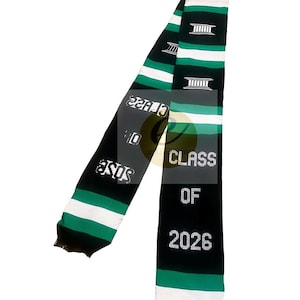May include: A graduation stole in green, black, and white stripes. The stole has the text "CLASS OF 2026" in white. The stole also has the text "ASOS" in white. The stole has a design of a building.