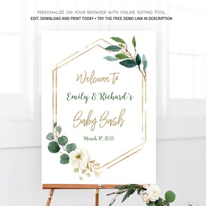 Puede incluir: Un cartel de bienvenida blanco con marcos geométricos dorados y hojas de eucalipto verdes. El texto dice "Bienvenido a Emily & Richard's Baby Bash 17 de marzo de 2023".