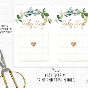 May include: Two printable baby bingo cards with a green and gold floral design. Each card has a 5x5 grid with spaces for guests to mark off gifts received at a baby shower. The cards are designed to be printed and trimmed in half.