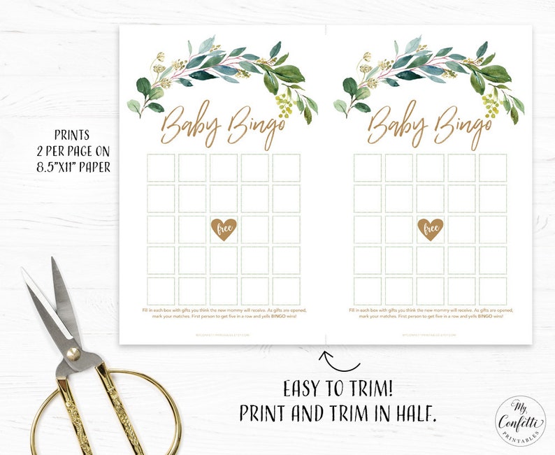 May include: Two printable baby bingo cards with a green and gold floral design. Each card has a 5x5 grid with spaces for guests to mark off gifts received at a baby shower. The cards are designed to be printed and trimmed in half.