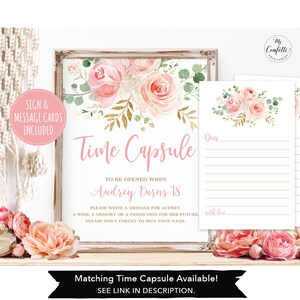 May include: A framed sign and message cards with a floral design. The sign reads "Time Capsule" and includes instructions for writing a message for Audrey. The design features pink roses and greenery. The message cards have a similar floral design.