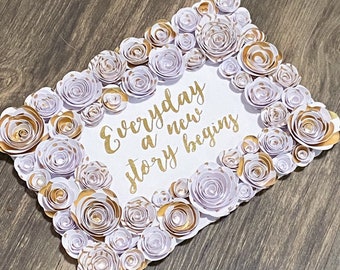 Gold Foil flower art, perfect for a wedding, with the message that “every day a new story begins” - gold and white flower art