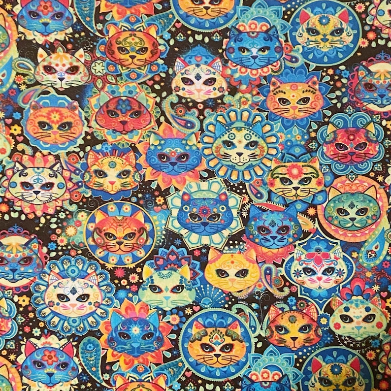 May include: A colorful fabric with a repeating pattern of cats with sugar skulls. The cats are surrounded by floral designs in shades of blue, green, orange, and yellow.