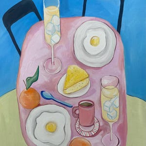 May include: A still-life painting of a breakfast scene. A pink table is set with two fried eggs, two glasses of a yellow beverage with ice cubes, a slice of cake, a cup of coffee, two oranges, and a blue spoon.