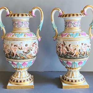 Pair of  Amphora-Style Capodimonte Vase, relief mythological scene, 19 century