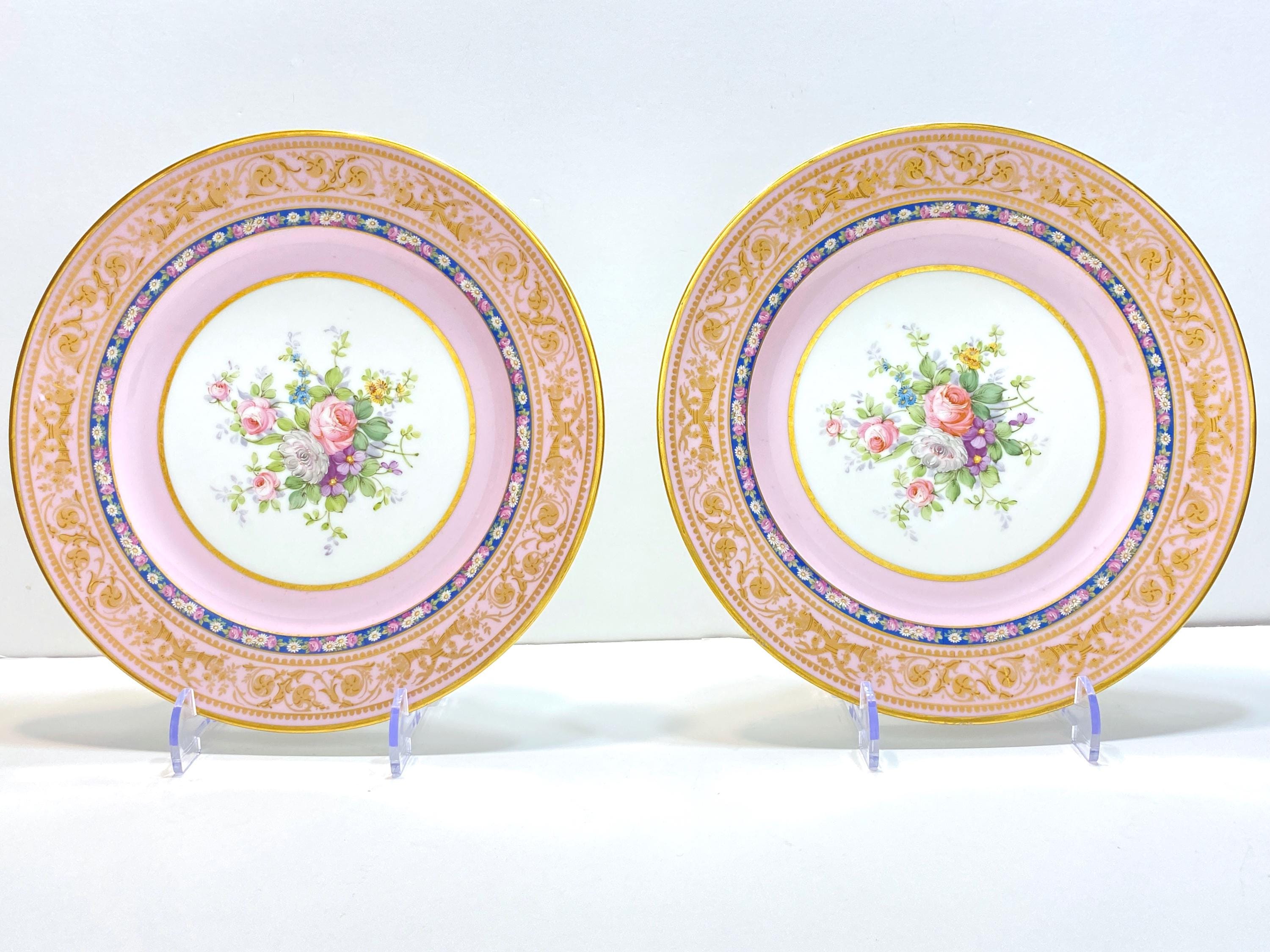 Pair of antique  Wm GUERIN & Co. Limoges French plates in pink and white with a bouquet of flowers in the center. ca. 1900s