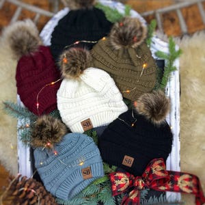 hat with interchangeable pom pom