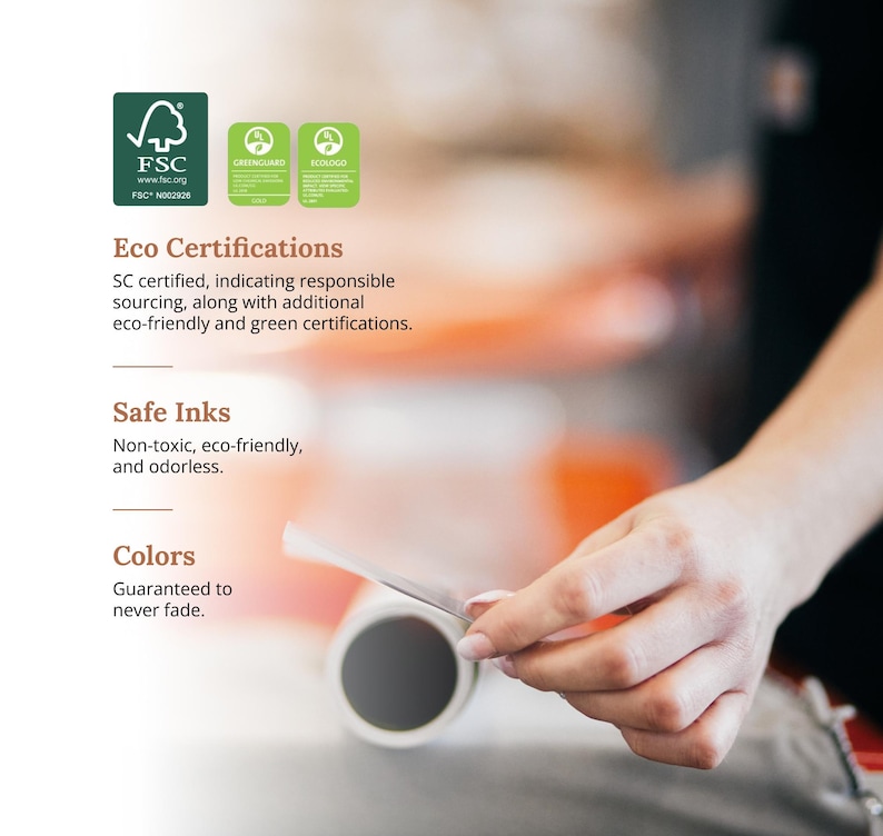 May include: A close-up of a roll of paper with a hand holding a piece of the paper. The paper is certified by the Forest Stewardship Council (FSC) and has GreenGuard and EcoLogo certifications. The text on the paper reads "Eco Certifications", "SC certified, indicating responsible sourcing, along with additional eco-friendly and green certifications.", "Safe Inks", "Non-toxic, eco-friendly, and odorless.", and "Colors", "Guaranteed to never fade."