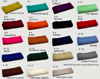 May include: A collection of 18 fabric swatches in various colours, including golden yellow, burgundy, peacock blue, red orange, ice green, black, red, magenta, rust, indigo, denim, blue, botanical green, biscotti, ashley blue, chocolate brown, natural white, and natural zati. Each swatch is labelled with a number and a colour name.
