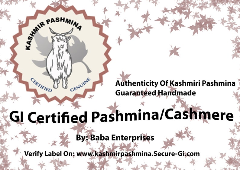 May include: A white background with a brown and white seal featuring a goat and the text "Kashmir Pashmina Certified Genuine". The text "Authenticity of Kashmiri Pashmina Guaranteed Handmade" is below the seal. The text "GI Certified Pashmina/Cashmere" is below the text. The text "By: Baba Enterprises" is below the text. The text "Verify Label On: www.kashmirpashmina.Secure-Gi.com" is below the text. The background is decorated with brown maple leaves.