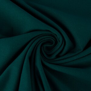 Jersey di cotone organico tinta unita verde abete larghezza 1,5 m