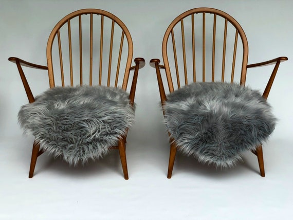 A Pair of Ercol 305 Tub Chairs in Light Blond Finish