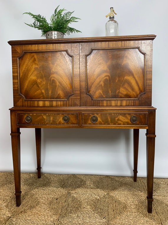 A Bevan Funnell Flame Mahogany Regency Cocktail Drinks Cabinet Sycamore Lined Twentieth Century