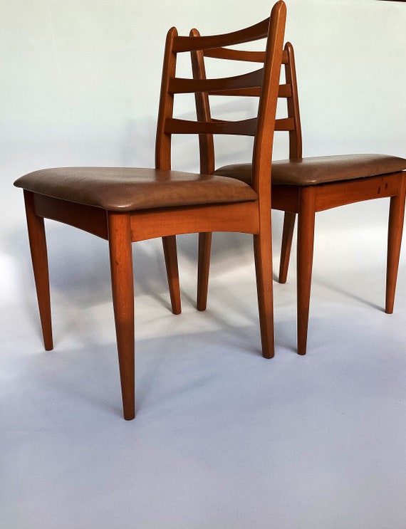 A Pair of Schreiber Mid Century Chairs with Tan Leatherette