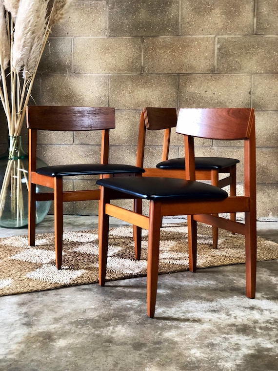 A Set of Three Danish Style Dining Office Chairs with Original Black Leatherette
