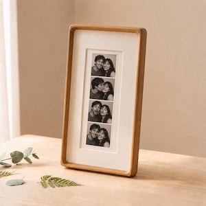 Fotolijst van massief walnoot- en teakhout voor fotohokjesfoto's en andere aandenkens.
