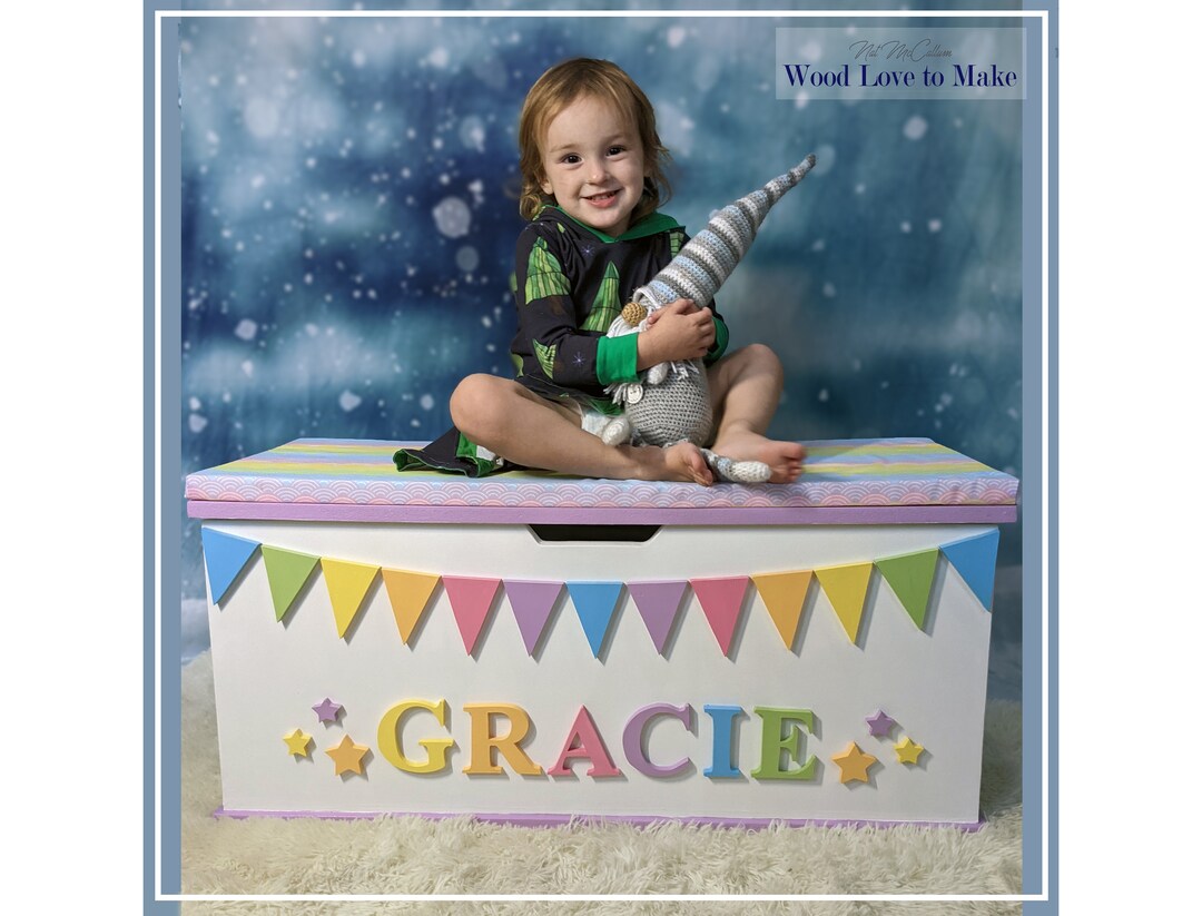XL Personalised Wooden Toy Box Soft Close, Large Rainbow Bunting Seated