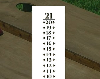 May include: Two wooden cornhole boards with red and blue bean bags. The boards have a numbered scoring system from 0 to 21.