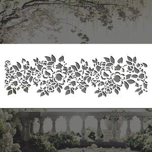 May include: A black and white floral stencil design with a repeating pattern of flowers and leaves. The stencil is perfect for creating a decorative border on walls, furniture, or crafts.
