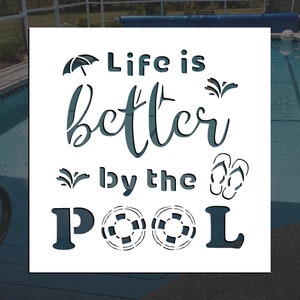 May include: White stencil with the text "Life is better by the POOL" in a blue font. The stencil includes images of an umbrella, palm trees, flip flops, and a life preserver.